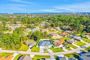 Contemporary coastal escape with heated pool, fenced yard, & outdoor dining - Image 3