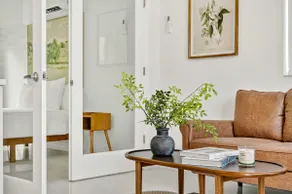 Sleek Kitchenette & Queen Bed - Image 2