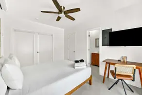 Sleek Kitchenette & Queen Bed - Image 3