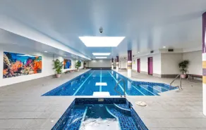 Modern 2BR Stay near Olympic Park|Pool Gym Parking - Image 5