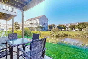 Dog-friendly, water-view townhome with shared pool - Image 2