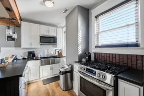 Elegant Historic Apartment with Craftsman Details - Image 2