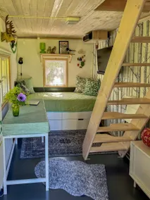 Small cabin with outdoor kitchen by forest stream - Image 3