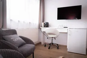 The Leutasch Retreat Comfort room offers peace, style, and comfort after hiking, cycling, or winter sports in the Alps around Seefeld. - Image 4