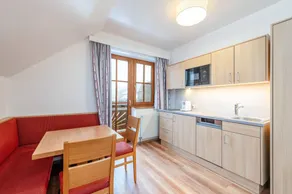 Children-friendly charming holiday apartment with sauna, pool & garden | Garden view - Image 5