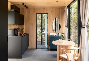 Whimsical Flower-Inspired Mirror Cabin by the Lake in the Enchanted Forests of Texas - Image 3