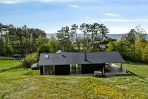 Holiday home with terrace, sauna & hot tub | Water view - Image 2