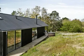 Holiday home with terrace, sauna & hot tub | Water view - Image 4
