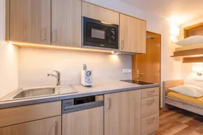 Children-friendly charming holiday apartment with sauna, pool & garden | Garden view - Image 4