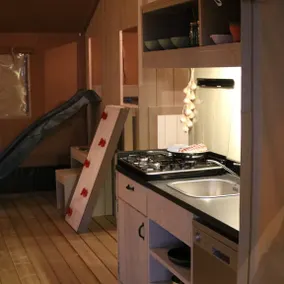 Glamping under canvas with a unique indoor play area featuring a slide. Great for adventurous families wanting to combine comfort with that outdoor feeling. - Image 4