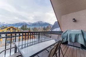 Mountain Views! Stunning Penthouse in Downtown Canmore Balcony + Fireplace - Image 2