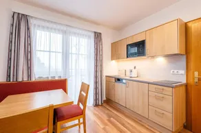 Children-friendly charming holiday apartment with sauna, pool & garden | Garden view - Image 3
