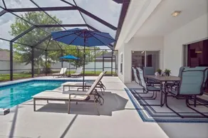 WHISPERING PALM Newly renovated cozy fenced in pool home sleeps 8 - Image 2