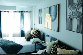Stylish Cozy Quiet Family Retreat and Romantic getaway Sleeps up to 7 with Fast Wifi Free Parking Work station Alexa enabled Fenced in Backyard for Pets Grill Party Patio Porch Beach Canal stadium Boardwalk Restaurants and much more - Image 1