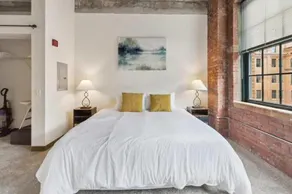 2BR Historic Loft Retreat With Pool & Gym - Image 3
