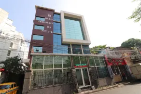 Capital O Hotel Presidency Inn - Image 3