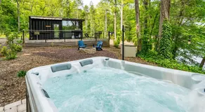 Modern Riverside Cabin w Hot Tub Fire Pit Kayaks - Image 2