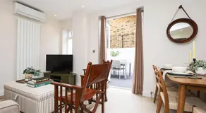 2BR Designer Apartment with Patio & Dining Space - Image 2