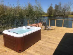 Chalet with a hot tub and terrace above the water - Image 3