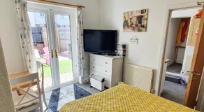 PAIGNTON S ONLY Ground floor Garden 2 Bedroom Apartment in front of the Pier & your Very own Private FREE Car space ,2 Double beds , 2 Single Beds , Kitchen , Air Fryer , 50 Blue ray Films ,Hotel Reception to Greet & Happily Help you - Image 2