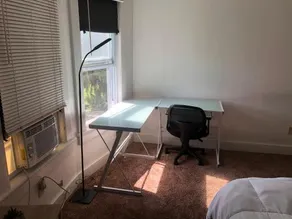 One bedroom in a shared half double house - Image 1