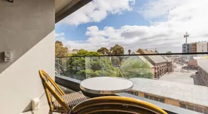 Concrete Junction - Sunny, Industrial Balcony Haven - Image 3