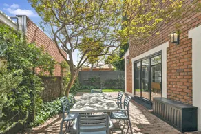 Family Retreat with Balcony and Courtyard - Image 5