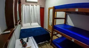 Suites e Quartos Em frente a Praia Grande -Na orla Flavia Alessandra - Image 2