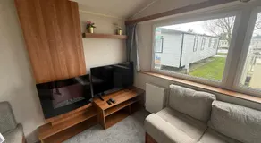6 Beds 2 Sofa bed Family friendly - unlimited Wi-Fi, Warm, Cozy Sun decking Caravan at Seawick Holiday Park - Image 2