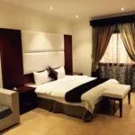 Holiday Plus Hotel Suites - Image 1