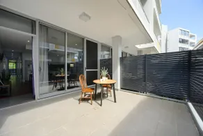 Ryde Warm 2BR Stay with Pool near Train Station - Image 5