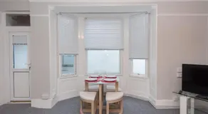 Spacious one bedroom apartment with a sofa bed offering a sea view sleeps four - Image 5