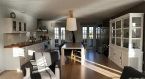 Peaceful boathouse located in a water activity-rich area - Image 3