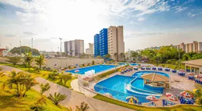 Flat com Piscinas Termais e Área de Lazer Completa - Image 4