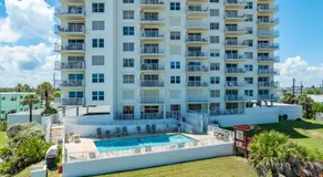 Direct oceanfront 2/2 corner condo with large balcony, heated pool, and garage parking - Image 5