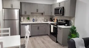 Modern 2BR Suite with Private Yard - Image 2