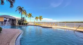 Charmant appartement en copropriété adapté aux familles avec jacuzzi, piscine et barbecue | Vue sur l'eau | Proche de la plage - Image 3