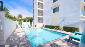 Across from Beach | Balcony • Pool • Parking • 2BR - Image 5