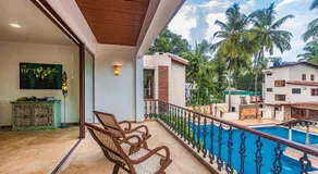 SaffronStays Casa Del Palms - 8BR luxury pool villa with gazebo, pickleball, bar & lawns near Nagaon Beach - Image 2