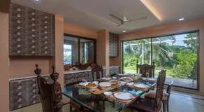 SaffronStays Aura - 4BR luxury pool villa with gym, BBQ deck, lawns & indoor games near Kihim Beach - Image 5
