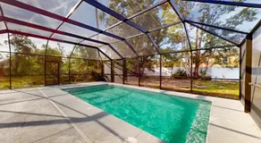 Spacious home with enclosed pool, open layout, washer/dryer, internet, & AC - Image 5