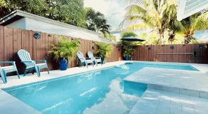 Stay Central: Relax in Our Heated Pool Oasis - Image 5