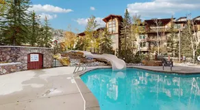 ski-in - ski-out condo with a deck ski views & a shared pool and hot tub - Image 3