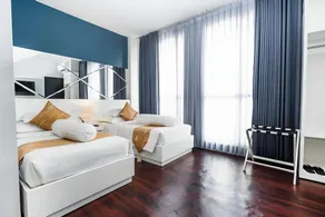 Homey Studio No Kitchen at Grand Darmo Suite Apartment By Travelio - Image 2