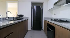 Stunning 2BR with Balcony & City Views - Image 4