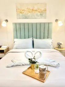 Amani Grand Resort Residences by JC SpaceRentals balcony pool view, Ground floor, 5mins from airport, free WIFI, NETFLIX - Image 2