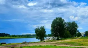 Natura Park Jurmala campsite with tent sites near a river - Image 5