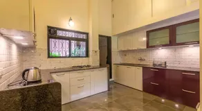 StayVista's Fairfield Villa - A green lawn and charming orchard await your retreat - Image 4