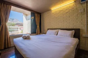 Villa Dazzle by StayVista - Unwind in a Mountain-City View Villa with a Terrace Pool - Image 4