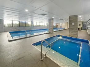 Ryde Warm 2BR Stay with Pool near Train Station - Image 3